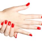 Close up of Female hands with red manicure