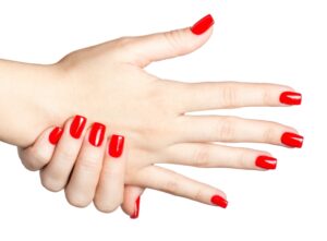 Close up of Female hands with red manicure