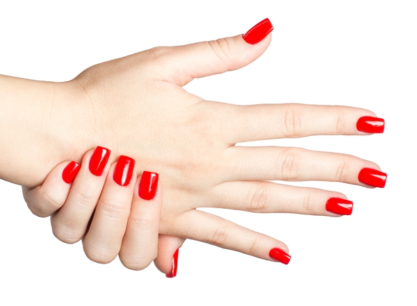 Close up of Female hands with red manicure