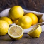 Group of fresh lemon on an old vintage wooden table