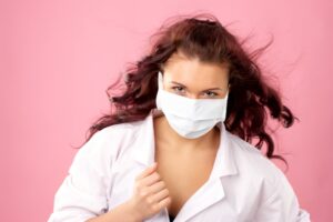 Young female doctor in mask