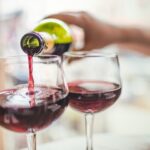 Pouring red wine in glasses