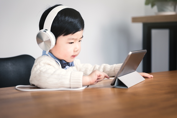 Little boy using digital tablets