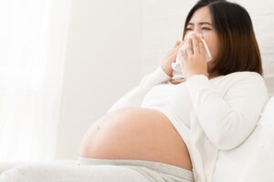 Flu during pregnancy, typically starts with a fever, achiness, and fatigue, followed by cold symptoms, such as a stuffy nose, sneezing, sore throat and especially dangerous for pregnant women