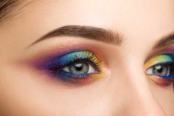 Close-up view of blue female eye with beautiful modern creative