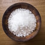 Sea salt in a wooden salt shaker.