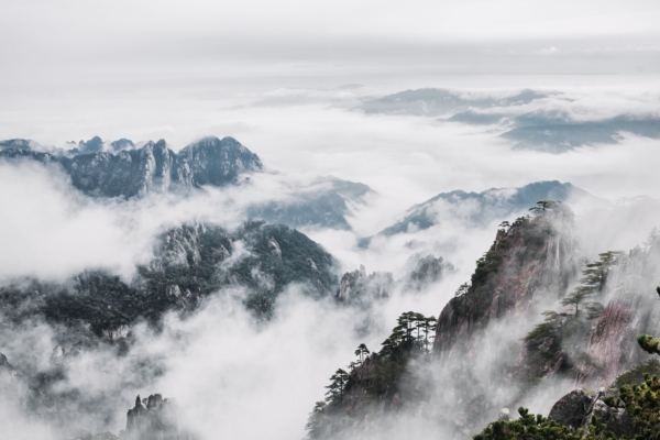 An,Aerial,View,Of,Mount,Huangshan,Covered,With,Clouds,In