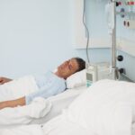 Male patient lying on a medical bed