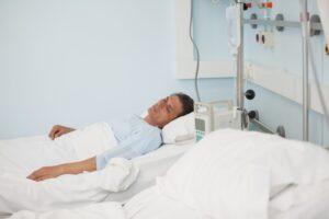Male patient lying on a medical bed