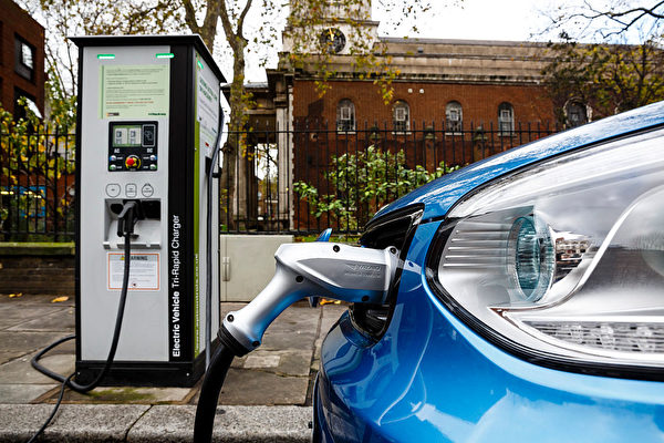 Go Ultra Low Electric Vehicle on charge on a London street